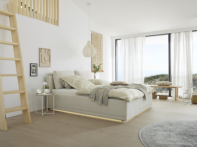 Polsterbett (2495-88-5000) in Stoff AURORA, Farbe: beige Nr. 02 (100 % Polyester), ca. B 196, H 90 (zzgl. Kissen), T 216 cm, Liegefläche ca. 180 x 200 cm, BSH 45 cm, Kopfteil glatt, belüfteter Bettkasten (Multilochung) und seitlich klappbarer Federholzrahmen, 28 Leisten mit 5-facher Härtegradverstellung, mit Mittelgurt und 5-facher Kopfteil-Rasterverstellung, inkl. Stoffhusse. Zubehör: 2er-Set Rückenkissen (2499-99-5000), LED-Beleuchtung (warmweiß) unter dem Bettkasten (2506-00-5000), 2 x 90 x 200 cm Matratzenset TTFK H2 und/oder H3 (3196-99-5000).