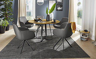 Dining table 6483-79-130, approx. Ø 130, H 77 cm; frame: blackened crude iron intersecting runners; tabletop: character oak (oiled)